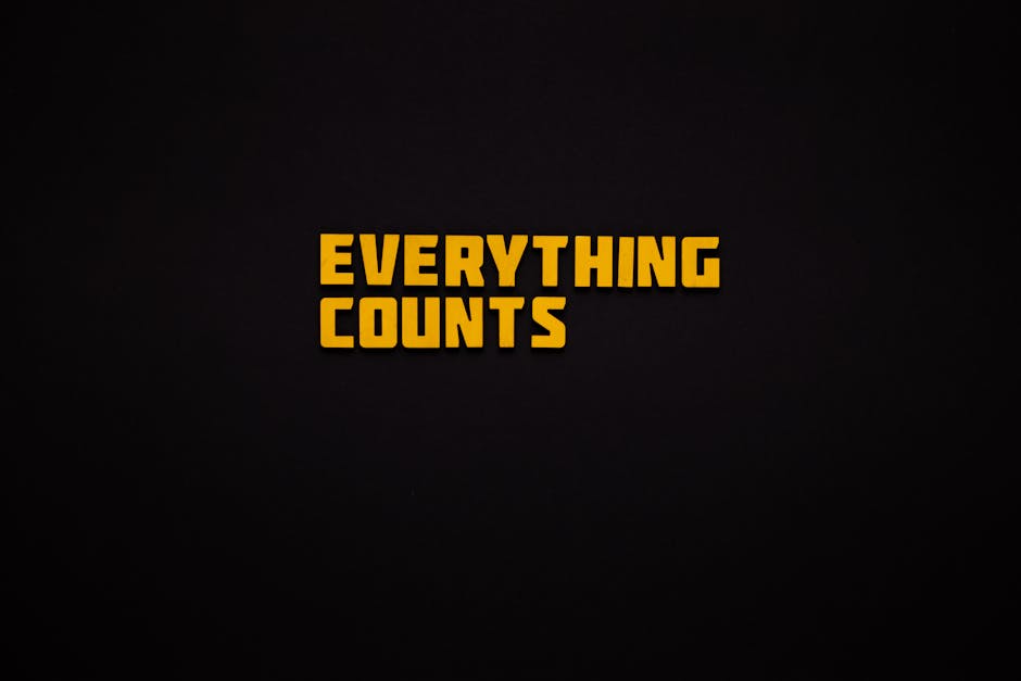 Yellow Message: Everything Counts, against a Black Background