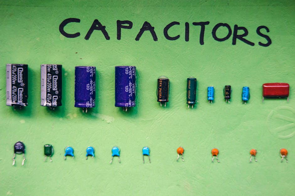 Collection of capacitors on green surface