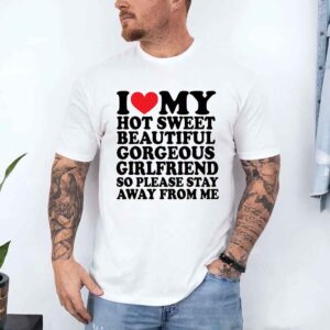 Man wearing a white t-shirt with playful text about his girlfriend's qualities.
